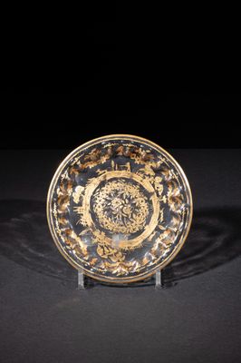 a close up of a plate on a table with a black background