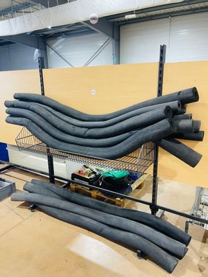 a lot of pipes that are sitting on a shelf