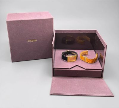 an image of a couple of rings in a box on a table