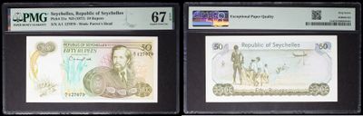 three different types of currency are displayed in a display case