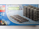 a box of lego city train tracks on the table