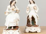 pair of antique porcelain figurines of a woman and a man