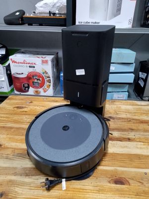 a robot that is sitting on a wooden table