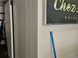 a blue bucket sitting in front of a sign that says overdrive post office
