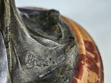 a close up of a statue of a horse on a table