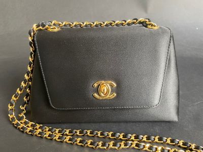 a chanel purse with a chain around it