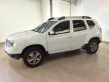 a picture of a white dacia parked in a garage