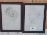 Deux dessins encadrés représentant un homme et une femme sont posés sur une table.