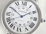 a silver wrist watch with roman numerals on it
