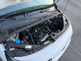 a car with its hood open and the engine in the car