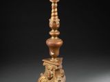 an antique brass candle holder with a clock on top of it