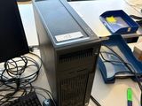 a desktop computer sitting on top of a desk next to a keyboard
