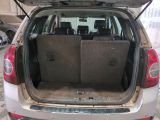 the back of a car with the trunk open and the seats folded down