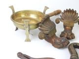 a lot of brass items that are on the table