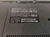 a close up of a laptop that has a sticker on it