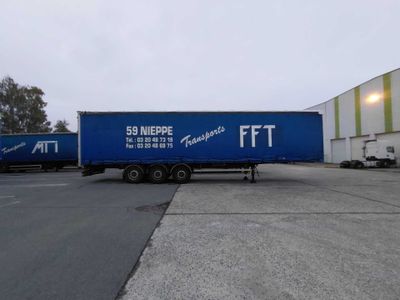 a semi truck that is parked in a parking lot