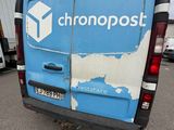 a blue van that is parked in a parking lot