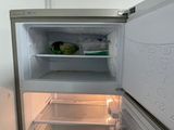 an open refrigerator with a lot of food inside of it