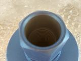 a blue cup sitting on top of a plastic bag