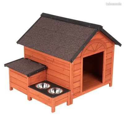 an image of a wooden dog house with two bowls in it