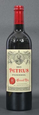 a bottle of red wine sitting next to a bottle of red wine