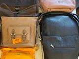 a lot of bags that are sitting on a table