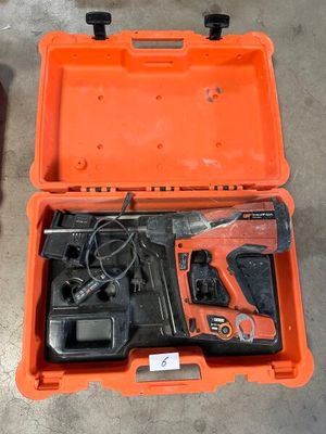 a tool in a case that is sitting on the floor