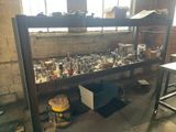 a shelf full of bottles and other items in a room