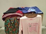 a pile of clothing that is sitting on a table
