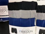 three pairs of men ' s black and blue boxers are on display