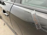 a sticker on the door of a car with a ruler on it