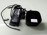 an image of a charger and a power cord on a table