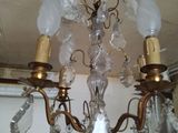 a chandelier that has a lot of glass hanging from it