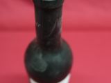 a bottle of wine that is sitting on a table