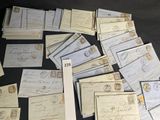 a lot of old letters and envelopes sitting on a table