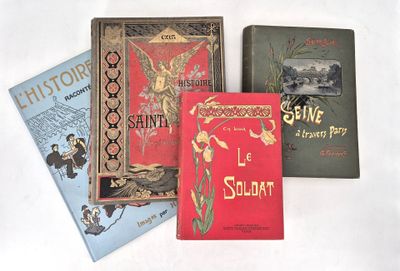 several books are lined up on a white surface with a white background
