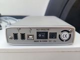 a white box with a silver device on top of it