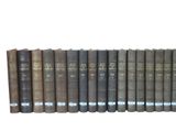 a row of books that are lined up on a shelf