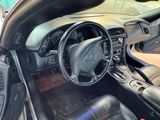 a picture of the interior of a car with a steering wheel