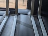 two treads that are sitting on the floor in the gym