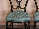two chairs sitting next to each other in a room