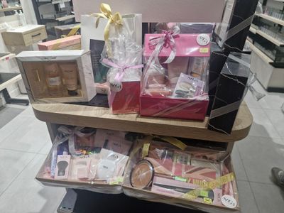 a cart with a lot of items on it in a store
