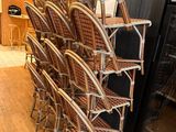 a lot of chairs that are stacked on top of each other