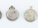 three silver lockes and a silver locke with a picture of a woman
