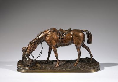 bronze statue of a horse with a saddle on its head