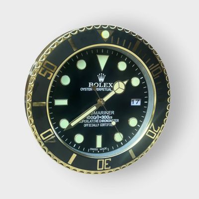 a black and gold watch on a white background