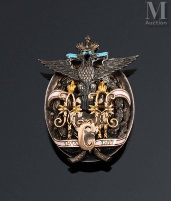 an image of a silver and gold broochle with a bird on it