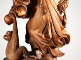 an image of a statue of a woman holding a bird