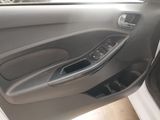the interior of a car with the door open and the driver ' s seat down