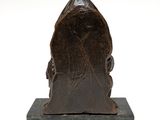 sculpture of a man ' s head on a marble base